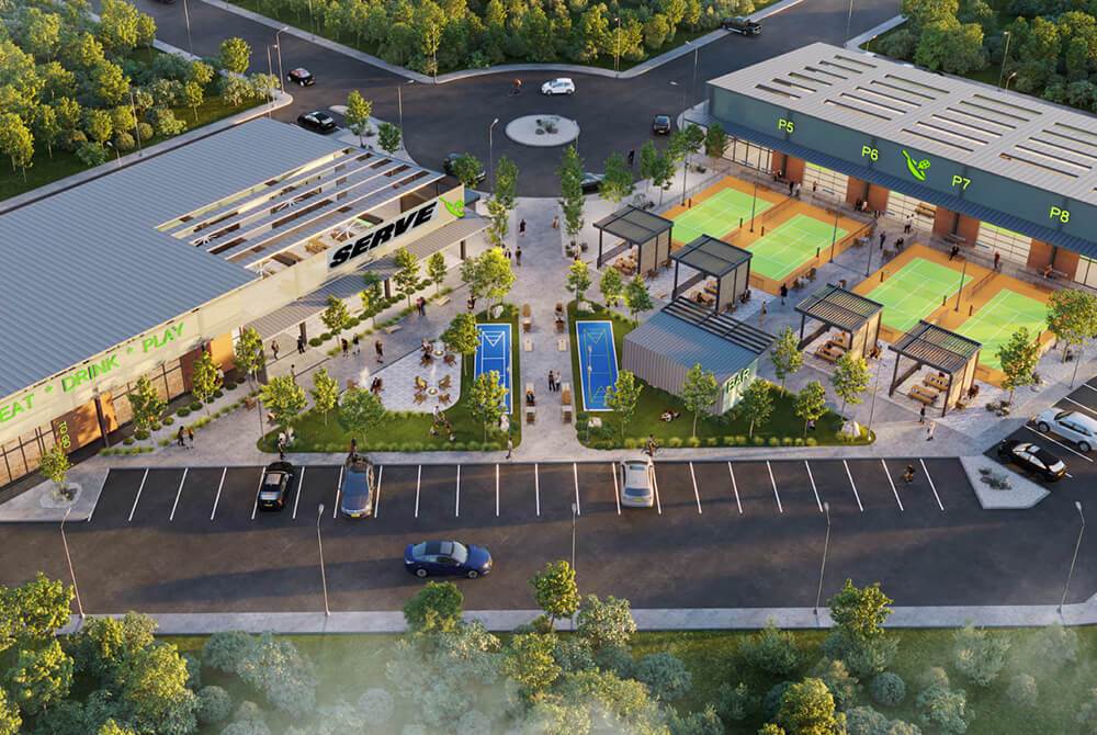 Aerial view of SERVE, a modern entertainment venue featuring pickleball courts, outdoor seating, a bar, and dining area—designed for guests to eat, drink, and play in a vibrant, social atmosphere.